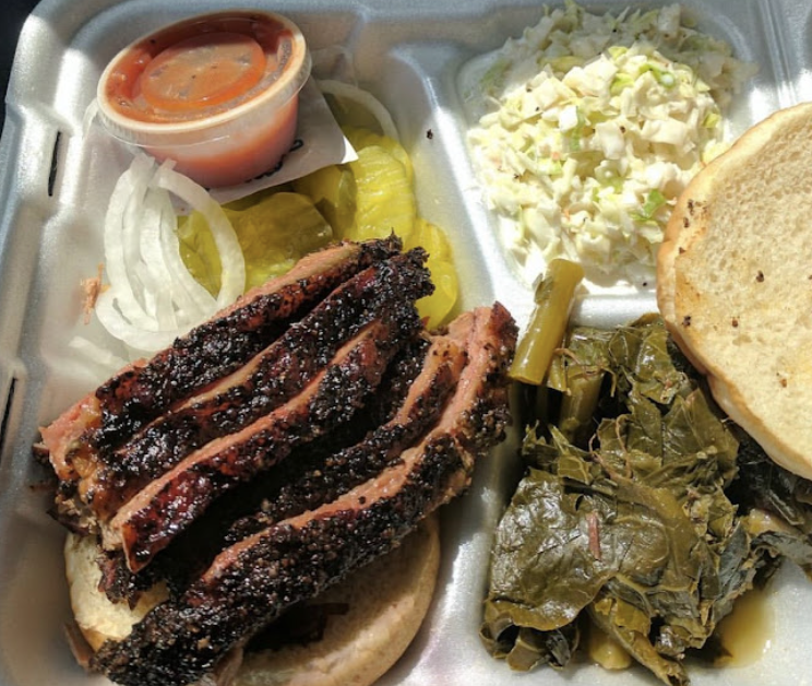 Blue Door Smokehouse signature dishes Brisket PlatePulled Pork PlateSmoked Sausage Sandwich